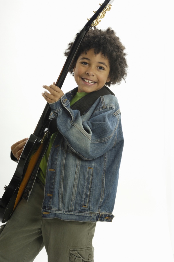 boy playing electric guitar